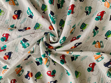 Load image into Gallery viewer, Organic Cotton Muslin Baby Swaddle Cloth with colourful car, mixer and digger print on white.
