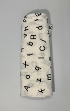 Load image into Gallery viewer, Organic Cotton Muslin Baby Swaddle Cloth with Black letters/alphabet pattern on white.
