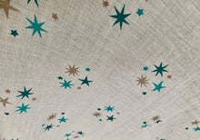 Load image into Gallery viewer, Organic Cotton Muslin Cloth with blue and gold stars varying shades on white.
