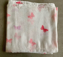 Load image into Gallery viewer, Organic Cotton Muslin Baby Swaddle Cloth with pink and lilac butterflies on white. Cloth folded neatly on table.
