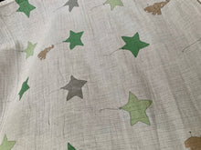 Load image into Gallery viewer, Organic Cotton Muslin Baby Swaddle Cloth with varying shaded of green/grey star balloons and floating brown elephant pattern on white.
