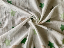 Load image into Gallery viewer, Organic Cotton Muslin Baby Swaddle Cloth with varying shaded of green/grey star balloons and floating brown elephant pattern on white.
