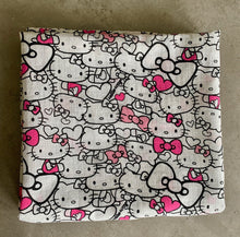 Load image into Gallery viewer, Organic Cotton Muslin Baby Swaddle Cloth with Pink and Black Hello kitty pattern on white.
