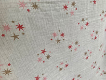 Load image into Gallery viewer, Organic Cotton Muslin Baby Swaddle Cloth with pink and gold star pattern on white.
