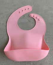 Load image into Gallery viewer, Silicone Bib BPA Free in blush light pink colour and 4 buttons with large crumb catcher scoop.
