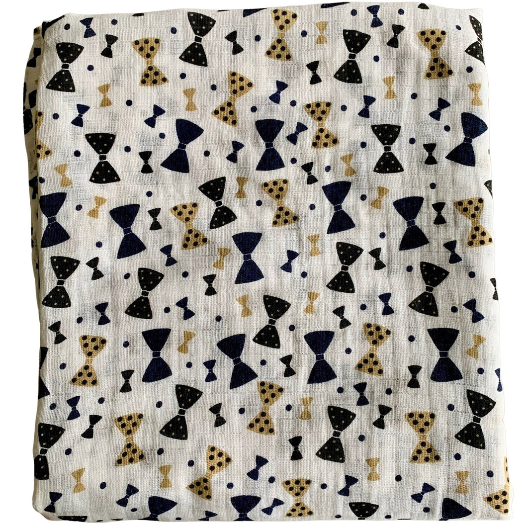 Organic Cotton Muslin Cloth Swaddle with black and gold bows varying sizes on white. 