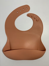 Load image into Gallery viewer, Silicone Bib BPA Free in a medium brown colour and 4 buttons with large crumb catcher scoop.
