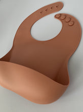 Load image into Gallery viewer, Silicone Bib BPA Free in a medium brown colour and 4 buttons with large crumb catcher scoop.
