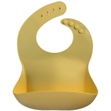 Load image into Gallery viewer, Silicone Bib BPA Free in a light pastel yellow colour and 4 buttons with large crumb catcher scoop.
