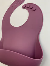 Load image into Gallery viewer, Silicone Bib BPA Free in a deep wine/maroon colour and 4 buttons with large crumb catcher scoop.
