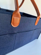 Load image into Gallery viewer, close up of navy blue nappy caddy organiser shows good quality felt and stitching.
