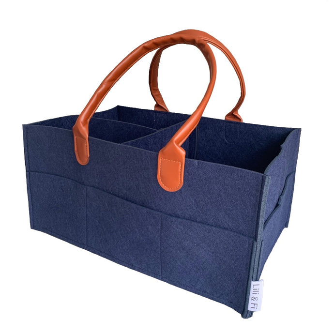 Navy blue nappy caddy organiser with brown PU leatherjacker handles on white background