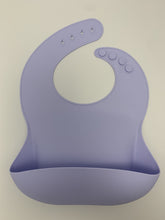 Load image into Gallery viewer, Silicone Bib BPA Free in a light pastel lilac colour and 4 buttons with large crumb catcher scoop.
