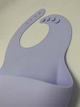 Load image into Gallery viewer, Silicone Bib BPA Free in a light pastel lilac colour and 4 buttons with large crumb catcher scoop.
