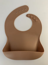 Load image into Gallery viewer, Silicone Bib BPA Free in a medium brown colour and 4 buttons with large crumb catcher scoop.
